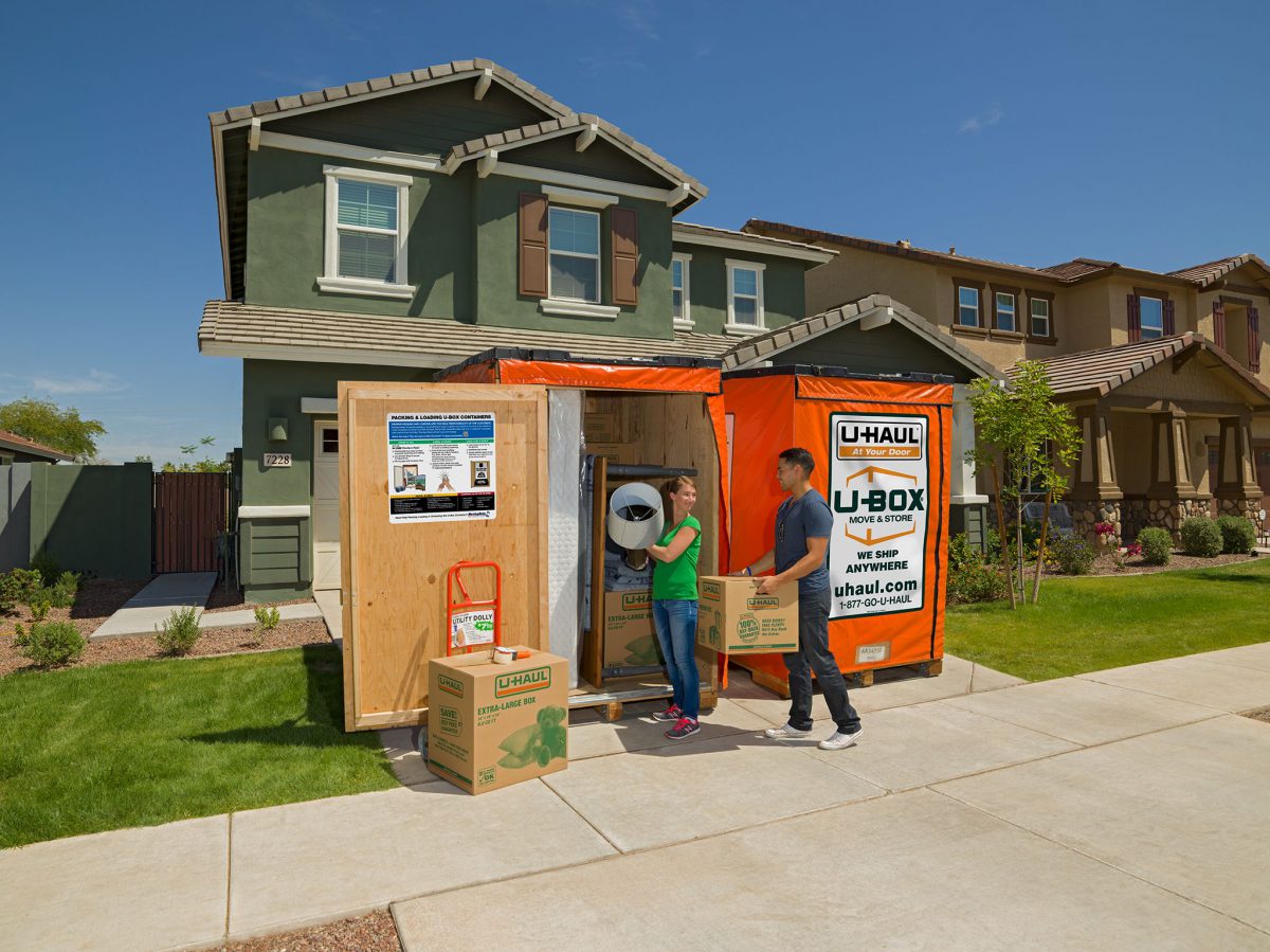 box-ubox U-Haul U-Box containers in a driveway — Too Good Movers loads and unloads U-Box in Las Vegas